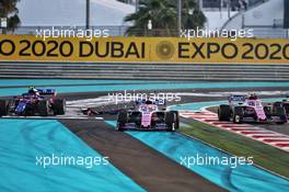(L to R): Pierre Gasly (FRA) Scuderia Toro Rosso STR14, Sergio Perez (MEX) Racing Point F1 Team RP19, and Lance Stroll (CDN) Racing Point F1 Team RP19 at the start of the race. 01.12.2019. Formula 1 World Championship, Rd 21, Abu Dhabi Grand Prix, Yas Marina Circuit, Abu Dhabi, Race Day.