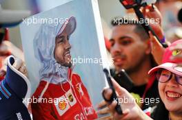 Sebastian Vettel (GER) Ferrari portrait with fans. 30.11.2019. Formula 1 World Championship, Rd 21, Abu Dhabi Grand Prix, Yas Marina Circuit, Abu Dhabi, Qualifying Day.