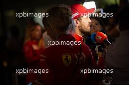 Sebastian Vettel (GER) Ferrari with the media. 30.11.2019. Formula 1 World Championship, Rd 21, Abu Dhabi Grand Prix, Yas Marina Circuit, Abu Dhabi, Qualifying Day.