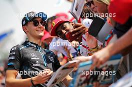 George Russell (GBR) Williams Racing signs autographs for the fans. 30.11.2019. Formula 1 World Championship, Rd 21, Abu Dhabi Grand Prix, Yas Marina Circuit, Abu Dhabi, Qualifying Day.