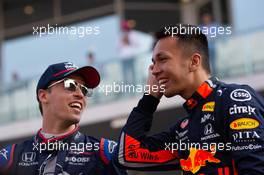 (L to R): Daniil Kvyat (RUS) Scuderia Toro Rosso and Alexander Albon (THA) Red Bull Racing on the drivers parade. 01.12.2019. Formula 1 World Championship, Rd 21, Abu Dhabi Grand Prix, Yas Marina Circuit, Abu Dhabi, Race Day.