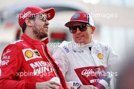 (L to R): Sebastian Vettel (GER) Ferrari with Kimi Raikkonen (FIN) Alfa Romeo Racing on the drivers parade. 01.12.2019. Formula 1 World Championship, Rd 21, Abu Dhabi Grand Prix, Yas Marina Circuit, Abu Dhabi, Race Day.