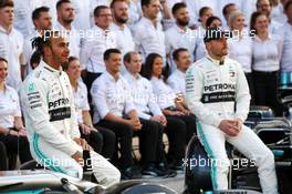 (L to R): Lewis Hamilton (GBR) Mercedes AMG F1 with Valtteri Bottas (FIN) Mercedes AMG F1 at a team photograph. 28.11.2019. Formula 1 World Championship, Rd 21, Abu Dhabi Grand Prix, Yas Marina Circuit, Abu Dhabi, Preparation Day.
