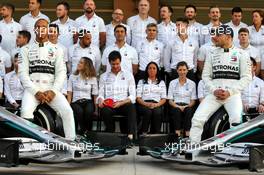 (L to R): Lewis Hamilton (GBR) Mercedes AMG F1 and Valtteri Bottas (FIN) Mercedes AMG F1 at a team photograph. 28.11.2019. Formula 1 World Championship, Rd 21, Abu Dhabi Grand Prix, Yas Marina Circuit, Abu Dhabi, Preparation Day.
