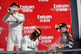 Lewis Hamilton (GBR) Mercedes AMG F1 celebrates his second position and World Championship on the podium with Max Verstappen (NLD) Red Bull Racing.                                03.11.2019. Formula 1 World Championship, Rd 19, United States Grand Prix, Austin, Texas, USA, Race Day.