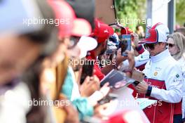 Kimi Raikkonen (FIN) Alfa Romeo Racing signs autographs for the fans. 02.11.2019. Formula 1 World Championship, Rd 19, United States Grand Prix, Austin, Texas, USA, Qualifying Day.