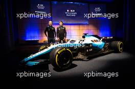 (L to R): Robert Kubica (POL) Williams Racing with team mate George Russell (GBR) Williams Racing. 11.02.2019. Williams Racing Livery Unveil, Williams Racing Headquarters, Grove, England.