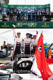 (L to R): Race winners Kazuki Nakajima (JPN) /Sebastien Buemi (SUI) / Fernando Alonso (ESP) #08 Toyota Gazoo Racing Toyota TS050 Hybrid, celebrate in parc ferme. 16.06.2019. FIA World Endurance Championship, Le Mans 24 Hours, Race, Le Mans, France. Sunday.