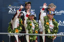 (L to R): Jose Maria Lopez (ARG); Kamui Kobayashi (JPN); and Mike Conway (GBR) #07 Toyota Gazoo Racing Toyota TS050 Hybrid, celebrate second position on the podium. 16.06.2019. FIA World Endurance Championship, Le Mans 24 Hours, Race, Le Mans, France. Sunday.