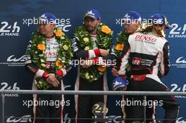 (L to R): second placed Kamui Kobayashi (JPN); Jose Maria Lopez (ARG); and Mike Conway (GBR) #07 Toyota Gazoo Racing Toyota TS050 Hybrid, on the podium. 16.06.2019. FIA World Endurance Championship, Le Mans 24 Hours, Race, Le Mans, France. Sunday.