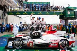 (L to R): Race winners Kazuki Nakajima (JPN) /Sebastien Buemi (SUI) / Fernando Alonso (ESP) #08 Toyota Gazoo Racing Toyota TS050 Hybrid, celebrate in parc ferme. 16.06.2019. FIA World Endurance Championship, Le Mans 24 Hours, Race, Le Mans, France. Sunday.