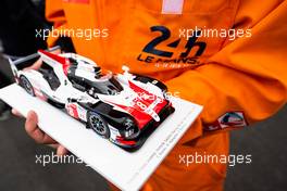Circuit atmosphere - a model #08 Toyota Gazoo Racing Toyota TS050 Hybrid held by a marshal. 15.06.2019. FIA World Endurance Championship, Le Mans 24 Hours, Race, Le Mans, France. Saturday.