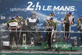 (L to R): Mike Conway (GBR) Toyota Gazoo Racing; Sebastien Buemi (SUI); and Kazuki Nakajima (JPN) Toyota Gazoo Racing, celebrate on the podium. 16.06.2019. FIA World Endurance Championship, Le Mans 24 Hours, Race, Le Mans, France. Sunday.