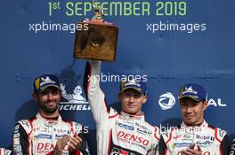 (L to R): race winners Jose Maria Lopez (ARG); Mike Conway of Great Britain and Toyota Gazoo Racing; and Kamui Kobayashi (JPN) #07 Toyota Gazoo Racing Toyota TS050 Hybrid, celebrate on the podium. 01.09.2019. FIA World Endurance Championship, Round 1, Silverstone, England. Sunday.