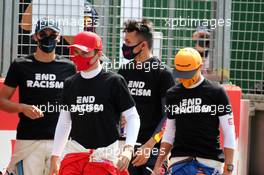 (L to R): Charles Leclerc (MON) Ferrari and Lando Norris (GBR) McLaren on the grid. 09.08.2020. Formula 1 World Championship, Rd 5, 70th Anniversary Grand Prix, Silverstone, England, Race Day.