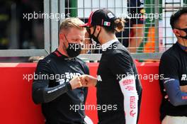 Kevin Magnussen (DEN) Haas F1 Team and Antonio Giovinazzi (ITA) Alfa Romeo Racing on the grid. 09.08.2020. Formula 1 World Championship, Rd 5, 70th Anniversary Grand Prix, Silverstone, England, Race Day.