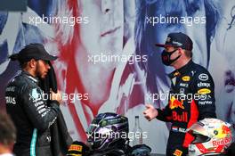 (L to R): Lewis Hamilton (GBR) Mercedes AMG F1 with race winner Max Verstappen (NLD) Red Bull Racing in parc ferme. 09.08.2020. Formula 1 World Championship, Rd 5, 70th Anniversary Grand Prix, Silverstone, England, Race Day.
