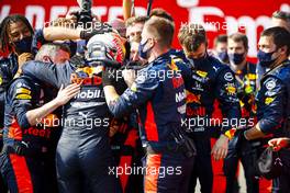 Race winner Max Verstappen (NLD) Red Bull Racing celebrates with the team in parc ferme. 09.08.2020. Formula 1 World Championship, Rd 5, 70th Anniversary Grand Prix, Silverstone, England, Race Day.
