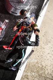 Race winner Max Verstappen (NLD) Red Bull Racing celebrates on the podium with second placed Lewis Hamilton (GBR) Mercedes AMG F1. 09.08.2020. Formula 1 World Championship, Rd 5, 70th Anniversary Grand Prix, Silverstone, England, Race Day.