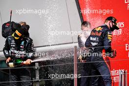 (L to R): Second placed Lewis Hamilton (GBR) Mercedes AMG F1 celebrates with race winner Max Verstappen (NLD) Red Bull Racing.                                09.08.2020. Formula 1 World Championship, Rd 5, 70th Anniversary Grand Prix, Silverstone, England, Race Day.