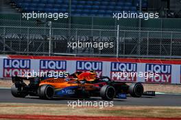 Alexander Albon (THA) Red Bull Racing RB16 and Lando Norris (GBR) McLaren MCL35 battle for position. 09.08.2020. Formula 1 World Championship, Rd 5, 70th Anniversary Grand Prix, Silverstone, England, Race Day.