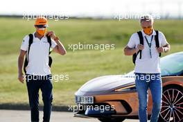 (L to R): Lando Norris (GBR) McLaren with Mark Berryman (GBR) Add Motorsports Director and Driver Manager.     08.08.2020. Formula 1 World Championship, Rd 5, 70th Anniversary Grand Prix, Silverstone, England, Qualifying Day.
