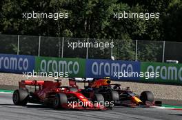 Sebastian Vettel (GER) Ferrari SF1000 and Alexander Albon (THA) Red Bull Racing RB16 battle for position. 05.07.2020. Formula 1 World Championship, Rd 1, Austrian Grand Prix, Spielberg, Austria, Race Day.