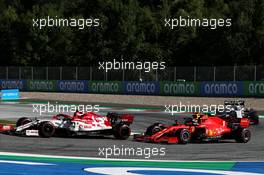 Antonio Giovinazzi (ITA) Alfa Romeo Racing C39 and Sebastian Vettel (GER) Ferrari SF1000 battle for position. 05.07.2020. Formula 1 World Championship, Rd 1, Austrian Grand Prix, Spielberg, Austria, Race Day.