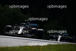 Valtteri Bottas (FIN) Mercedes AMG F1 W11 leads Lewis Hamilton (GBR) Mercedes AMG F1 W11. 05.07.2020. Formula 1 World Championship, Rd 1, Austrian Grand Prix, Spielberg, Austria, Race Day.
