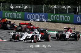 Daniil Kvyat (RUS) AlphaTauri AT01 and Antonio Giovinazzi (ITA) Alfa Romeo Racing C39 battle for position. 05.07.2020. Formula 1 World Championship, Rd 1, Austrian Grand Prix, Spielberg, Austria, Race Day.