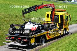 The Haas VF-20 of race retiree Kevin Magnussen (DEN) Haas F1 Team is recovered back to the pits on the back of a truck. 05.07.2020. Formula 1 World Championship, Rd 1, Austrian Grand Prix, Spielberg, Austria, Race Day.