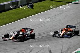 Alexander Albon (THA) Red Bull Racing RB16 and Lando Norris (GBR) McLaren MCL35 battle for position. 05.07.2020. Formula 1 World Championship, Rd 1, Austrian Grand Prix, Spielberg, Austria, Race Day.