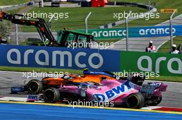 Lando Norris (GBR) McLaren MCL35 and Sergio Perez (MEX) Racing Point F1 Team RP19 battle for position. 05.07.2020. Formula 1 World Championship, Rd 1, Austrian Grand Prix, Spielberg, Austria, Race Day.