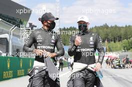 (L to R): Lewis Hamilton (GBR) Mercedes AMG F1 with his team mate Valtteri Bottas (FIN) Mercedes AMG F1 in qualifying parc ferme. 04.07.2020. Formula 1 World Championship, Rd 1, Austrian Grand Prix, Spielberg, Austria, Qualifying Day.