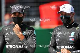 (L to R): Lewis Hamilton (GBR) Mercedes AMG F1 with his team mate in qualifying parc ferme. 04.07.2020. Formula 1 World Championship, Rd 1, Austrian Grand Prix, Spielberg, Austria, Qualifying Day.