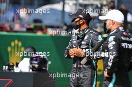 Lewis Hamilton (GBR) Mercedes AMG F1 and team mate Valtteri Bottas (FIN) Mercedes AMG F1 W11 in qualifying parc ferme. 04.07.2020. Formula 1 World Championship, Rd 1, Austrian Grand Prix, Spielberg, Austria, Qualifying Day.