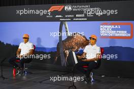 (L to R): Carlos Sainz Jr (ESP) McLaren and Lando Norris (GBR) McLaren in the FIA Press Conference. 02.07.2020. Formula 1 World Championship, Rd 1, Austrian Grand Prix, Spielberg, Austria, Preparation Day.