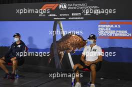 (L to R): Daniil Kvyat (RUS) AlphaTauri and Pierre Gasly (FRA) AlphaTauri in the FIA Press Conference. 02.07.2020. Formula 1 World Championship, Rd 1, Austrian Grand Prix, Spielberg, Austria, Preparation Day.