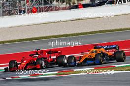 Sebastian Vettel (GER) Ferrari SF1000 and Lando Norris (GBR) McLaren MCL35. 27.02.2020. Formula One Testing, Day Two, Barcelona, Spain. Thursday.