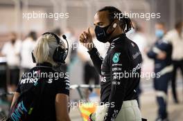 Lewis Hamilton (GBR) Mercedes AMG F1 in the pits with Angela Cullen (NZL) Mercedes AMG F1 Physiotherapist while the race is stopped. 29.11.2020. Formula 1 World Championship, Rd 15, Bahrain Grand Prix, Sakhir, Bahrain, Race Day.