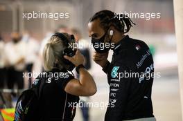 Lewis Hamilton (GBR) Mercedes AMG F1 in the pits with Angela Cullen (NZL) Mercedes AMG F1 Physiotherapist while the race is stopped. 29.11.2020. Formula 1 World Championship, Rd 15, Bahrain Grand Prix, Sakhir, Bahrain, Race Day.