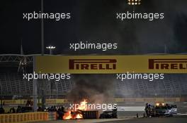 Marshals put out the fire of after Romain Grosjean (FRA) Haas F1 Team VF-20 crashed at the start of the race and exploded into flames. 29.11.2020. Formula 1 World Championship, Rd 15, Bahrain Grand Prix, Sakhir, Bahrain, Race Day.