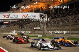 Daniil Kvyat (RUS) AlphaTauri AT01 and Carlos Sainz Jr (ESP) McLaren MCL35 at the start of the race. 29.11.2020. Formula 1 World Championship, Rd 15, Bahrain Grand Prix, Sakhir, Bahrain, Race Day.