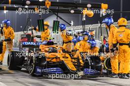 Lando Norris (GBR) McLaren MCL35 makes a pit stop. 29.11.2020. Formula 1 World Championship, Rd 15, Bahrain Grand Prix, Sakhir, Bahrain, Race Day.
