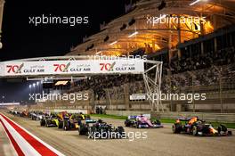 Valtteri Bottas (FIN) Mercedes AMG F1 W11 and Max Verstappen (NLD) Red Bull Racing RB16 at the start of the race. 29.11.2020. Formula 1 World Championship, Rd 15, Bahrain Grand Prix, Sakhir, Bahrain, Race Day.