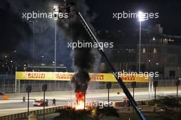 Marshals put out the fire of after Romain Grosjean (FRA) Haas F1 Team VF-20 crashed at the start of the race and exploded into flames. 29.11.2020. Formula 1 World Championship, Rd 15, Bahrain Grand Prix, Sakhir, Bahrain, Race Day.