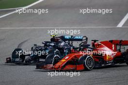 Sebastian Vettel (GER) Ferrari SF1000 and Valtteri Bottas (FIN) Mercedes AMG F1 W11 battle for position. 29.11.2020. Formula 1 World Championship, Rd 15, Bahrain Grand Prix, Sakhir, Bahrain, Race Day.