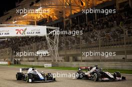 George Russell (GBR) Williams Racing FW43 and Romain Grosjean (FRA) Haas F1 Team VF-20 at the start of the race. 29.11.2020. Formula 1 World Championship, Rd 15, Bahrain Grand Prix, Sakhir, Bahrain, Race Day.