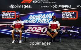 (L to R): Antonio Giovinazzi (ITA) Alfa Romeo Racing and Kimi Raikkonen (FIN) Alfa Romeo Racing in the FIA Press Conference. 26.11.2020. Formula 1 World Championship, Rd 15, Bahrain Grand Prix, Sakhir, Bahrain, Preparation Day.