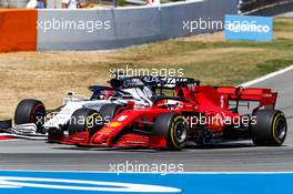 Sebastian Vettel (GER) Ferrari SF1000 and Daniil Kvyat (RUS) AlphaTauri AT01 battle for position. 16.08.2020. Formula 1 World Championship, Rd 6, Spanish Grand Prix, Barcelona, Spain, Race Day.